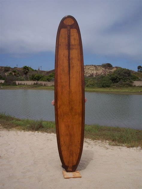 solid wood surfboard aug   waverider