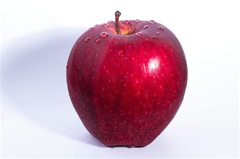 selective focus photo  delicious red apple fruit  white