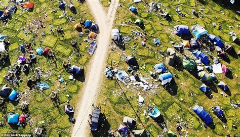 ocean of tents and plastic trash after revellers leave