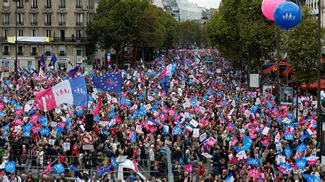 tens of thousands rally in france against ivf surrogacy for same sex families — rt world news