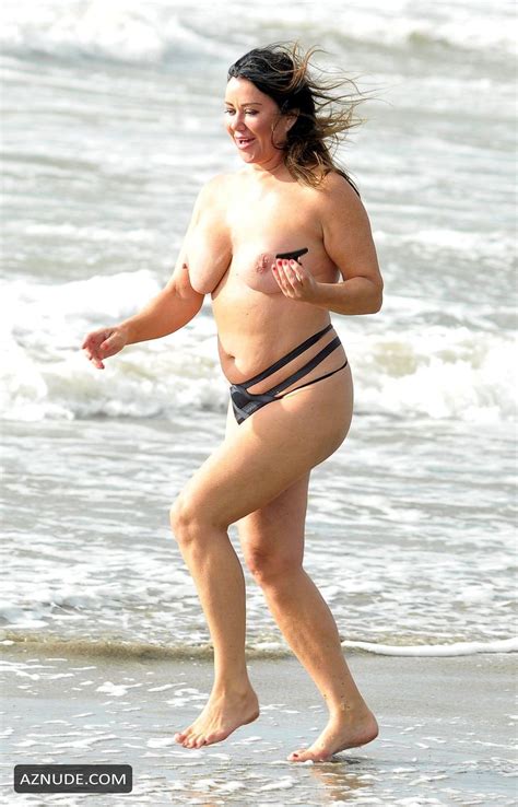 lisa appleton goes topless during her holiday in the