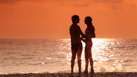 couple silhouette at the beach sunset light stock footage video