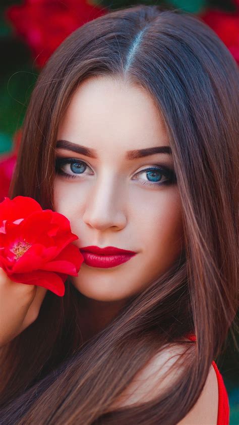 blue eyes woman with flower red outdoor photoshoot