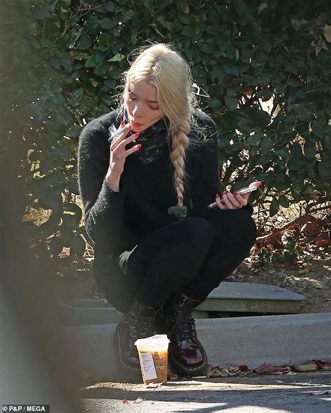 Anya Taylor Joy Perches On The Pavement To Smoke A Cigarette Daily
