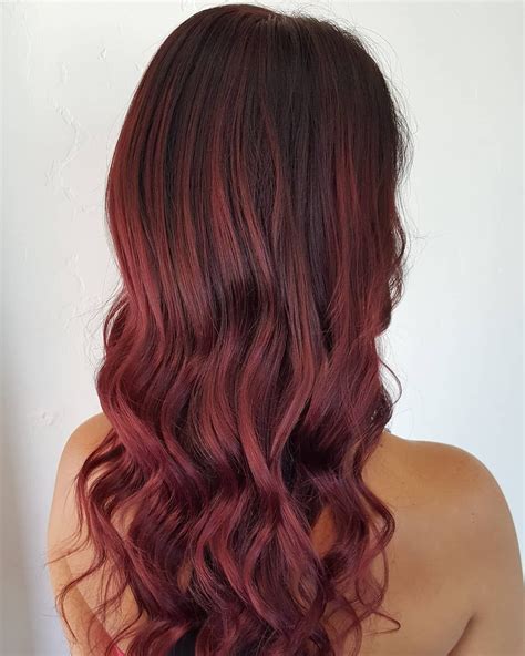 cranberry red   sauciest hair color trend   holiday season