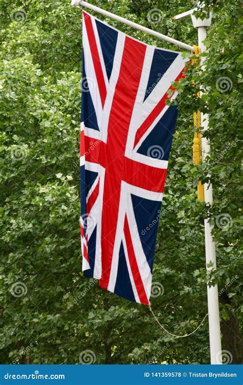 union jack flag flying vertically  trees   background stock photo image  london