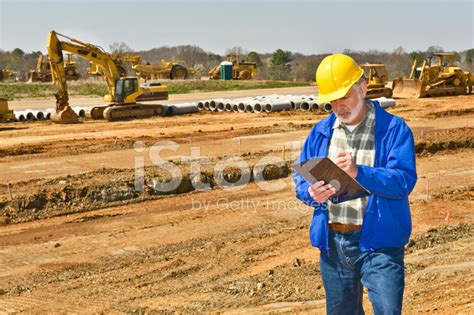 foreman keeping records  highway construction project stock