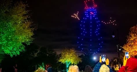 dozens  drones adancing town   elm lights  sky  innovative holiday drone show