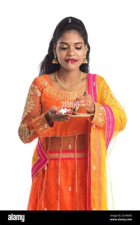Beautiful Indian Young Girl Holding Pooja Thali Or Performing Worship