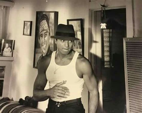black  white photo   man wearing  hat   room  pictures