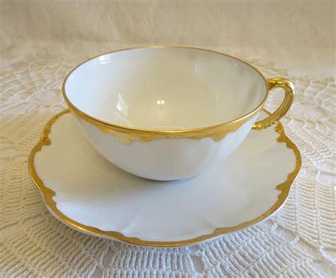 haviland limoges white teacup  saucer  hand painted gold trim