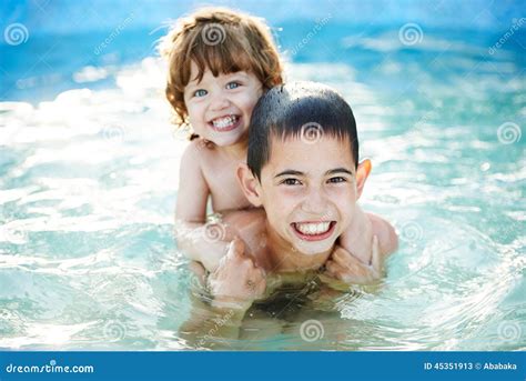 Brother And Sister Bathe Outside In Pool Stock Image Image Of