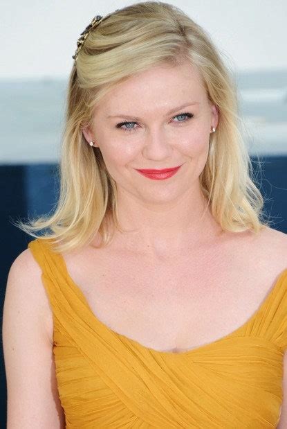 kirsten dunst shows us one surefire way to wear red lipstick this