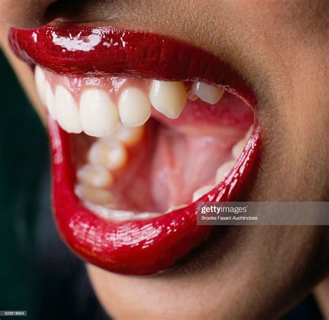 Woman With Red Lipstick Opening Mouth Photo Getty Images