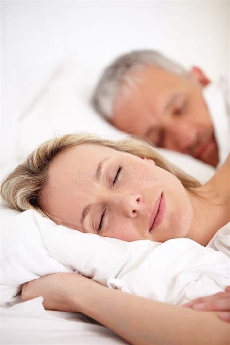 Comfort In Companionship Closeup Portrait Of A Mature Couple Sleeping