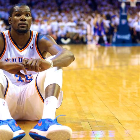 kevin durant sits on court facing away as westbrook attempts crucial