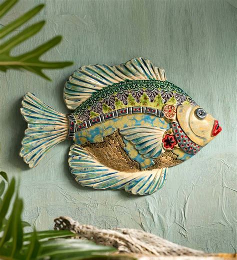 hand sculpted ceramic fish wall art wind  weather