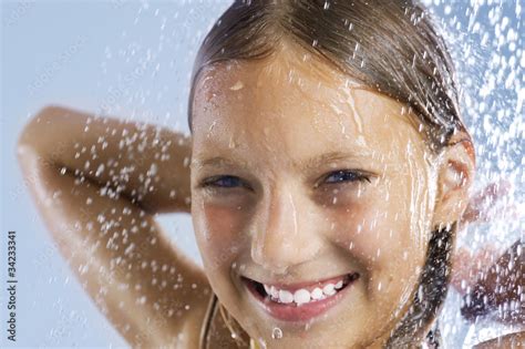 foto stock happy teen girl taking shower bath adobe stock