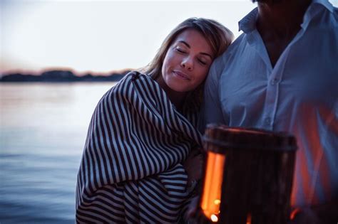 Premium Photo Couple In Love Covered In Blanket And Sharing Evening