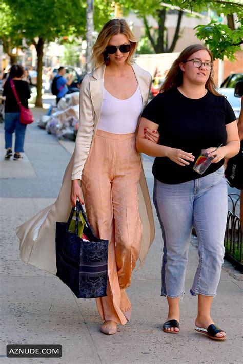 Karlie Kloss Sexy Steps Out In Satin Patterned Peach Colored Pants And