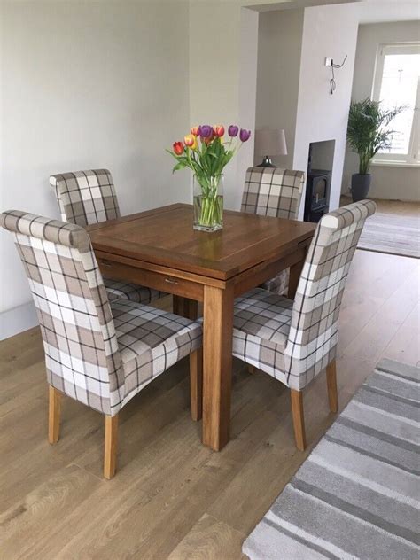 solid oak extending dining table   scroll  fabric chairs