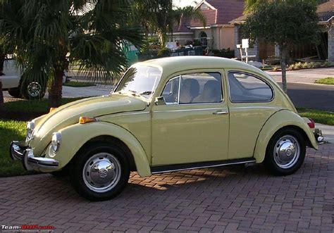 car   pale yellow volkswagon beetle