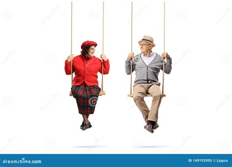 Elderly Couple On Swings Looking At Each Other Stock Image Image Of