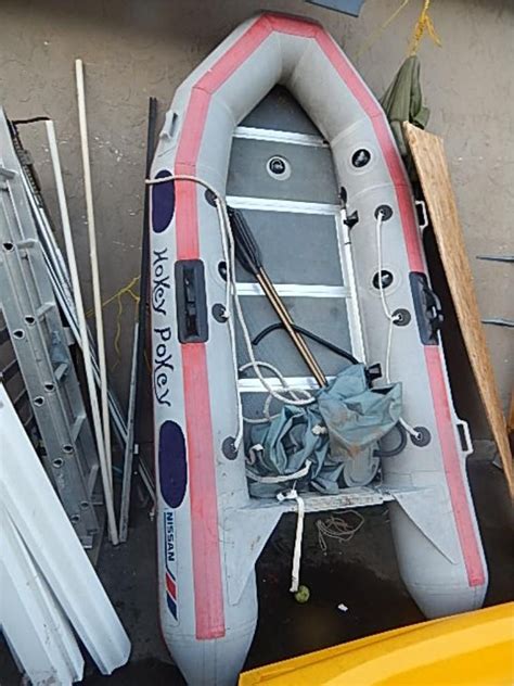 nissan inflatable boat  long aluminum hard bottom includes oars pump cover hokey p