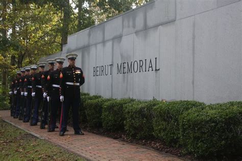 marines stand  attention    beirut memorial observance marine corps family