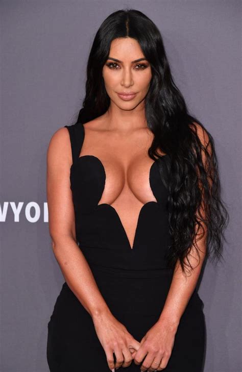 kim kardashian flashes insane cleavage with kourtney kardashian at