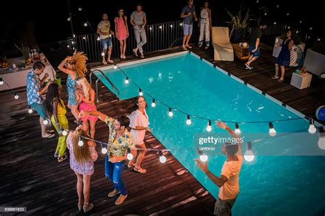 Friends Enjoying Pool Party Photo Getty Images
