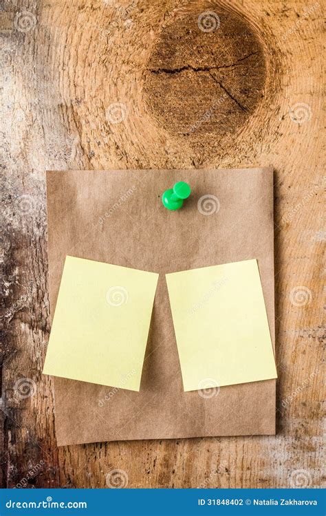 brown recycled paper sticky note  green push pin  small  stock photo image  message