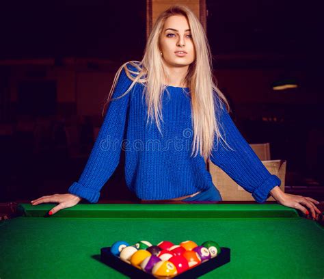 Cute Blonde Posing Near A Billiard Table With A Pyramid Of Balls Stock