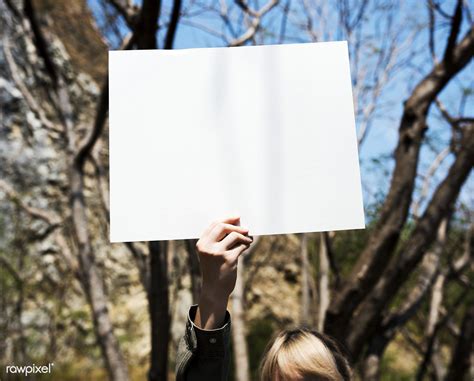 young woman hands holding blank empty paper poster mockup web design