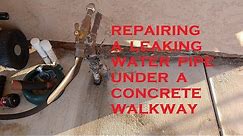 Repairing a Leaking Water Pipe Under a Concrete Walkway