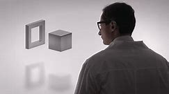 Computer graphics. A male scientist in glasses and a white coat against a white screen with a symbolic solution to the problem and its implementation. The concept of creating a physical basis