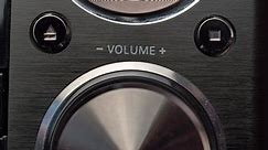 Adjusting Volume on Stereo Set Close-Up