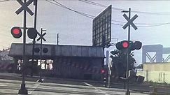 GTA freight train passes level crossing