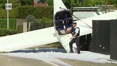 Video: Pilot deploys parachute, plane crashes into sidewalk outside Bruges