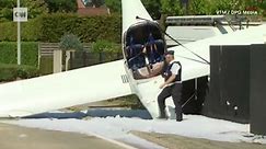 Video: Pilot deploys parachute, plane crashes into sidewalk outside Bruges
