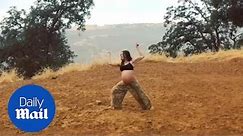 Pregnant mother dances serenely outdoors before unassisted birth