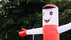 Air dancer tube man, sky dancer inflatable air man outside roadside.