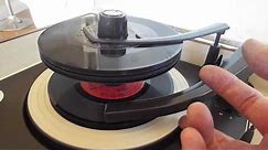 Zenith Stereo record player playing a stack of 45 RPM records