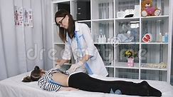 Female Doctor Massages the Back of the Little Girl in the Clinic. Stock Video - Video of girl, orthopedic: 137987423