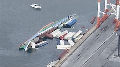 Japan cargo ship capsizes dumping containers into the ocean