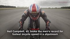 See this man ride a bicycle at a record 174 mph