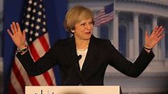 May: International institutions need reforming