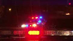 stock footage police lights flashing at night downtown at crime scene