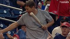 Fan catches bat on the fly, gets a kiss