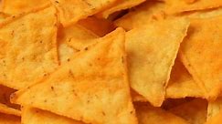 Close up of rotating nacho chips. No sound.